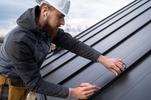 Roofing expert inspecting metal roof