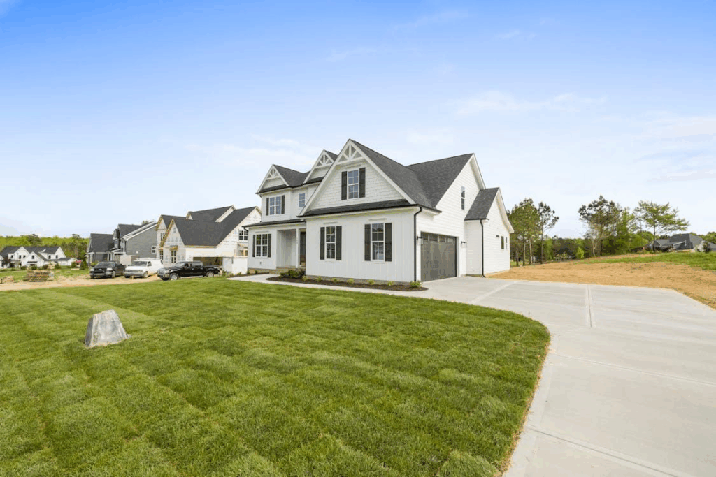 Suburban house with well-maintained roof under clear sky