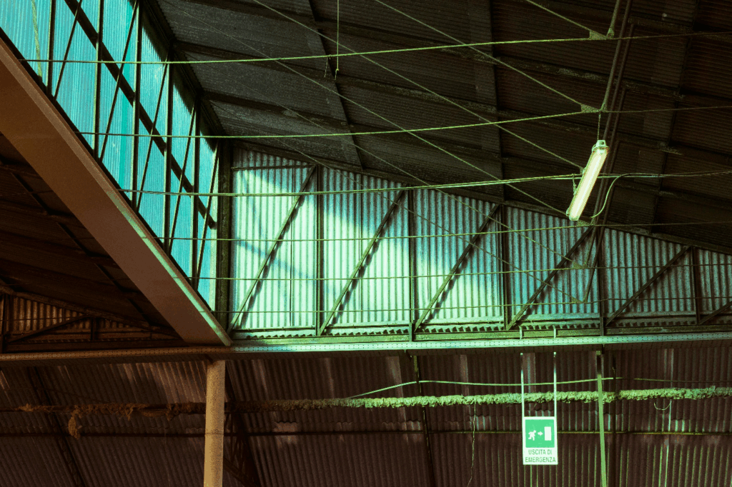 view of metal roof and side walls from below