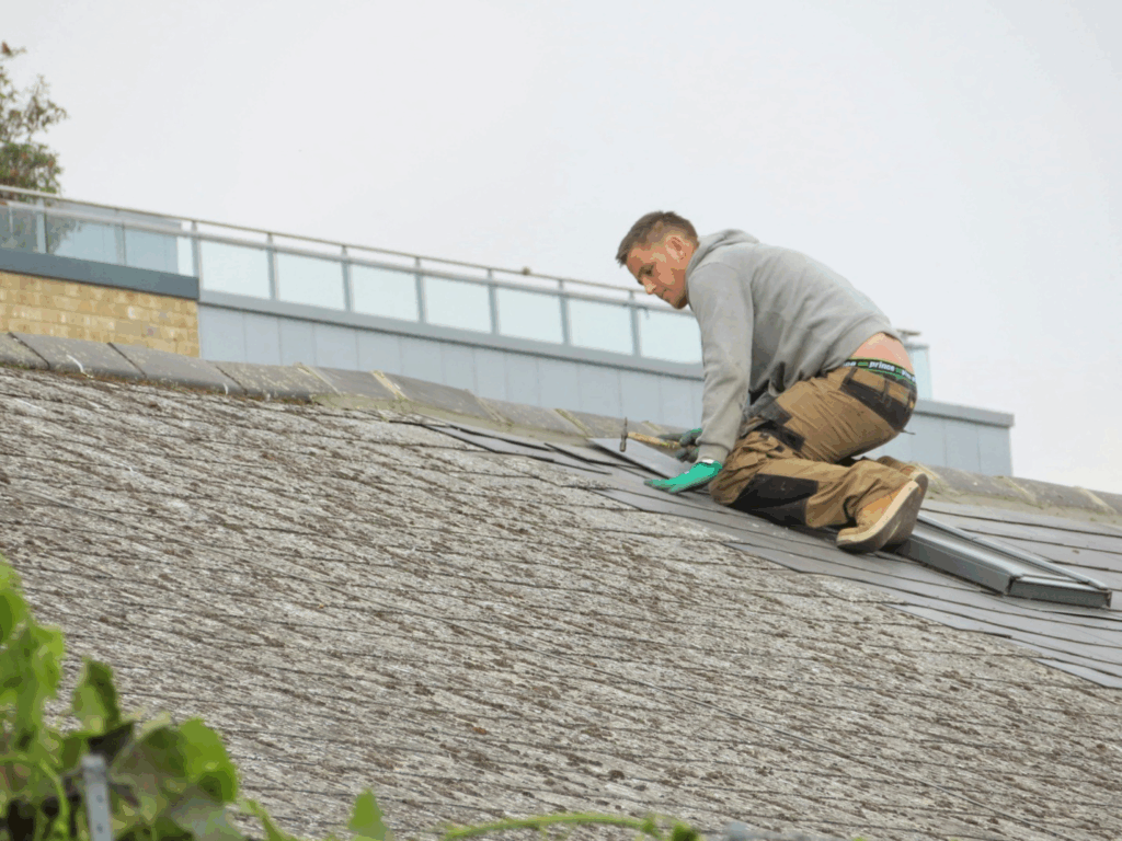 a roofing contractor working on a roof