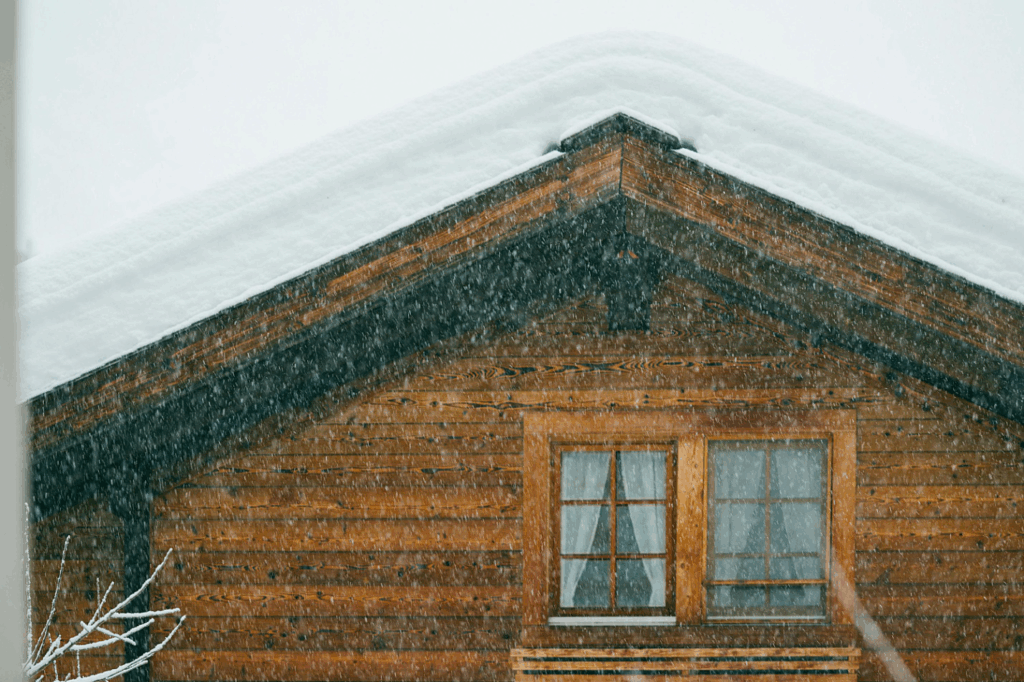 snow accumulating on top of a roof