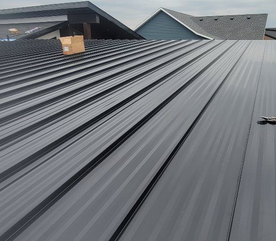 Brand new roofing material laid out on a house.