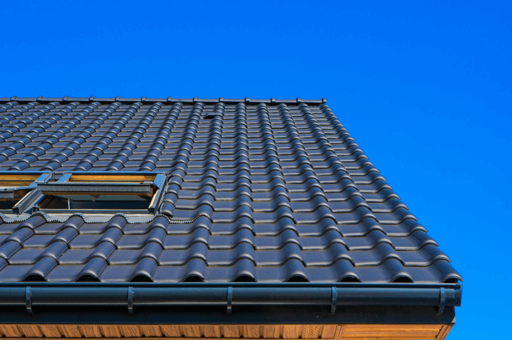 a metal roof on a house against a blue sky