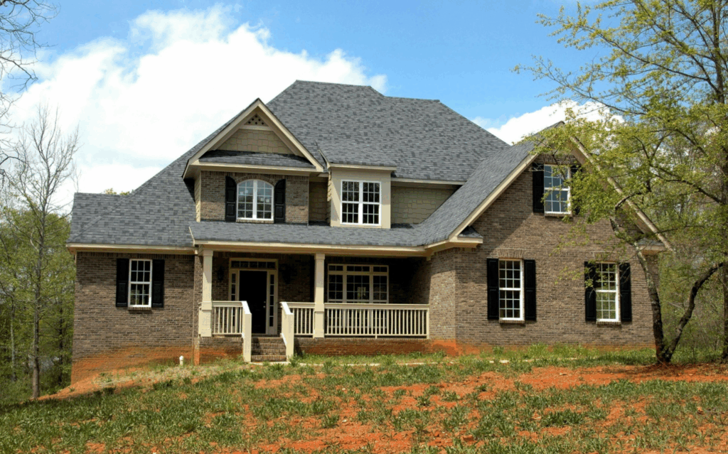 grey and brown house with shingle roof