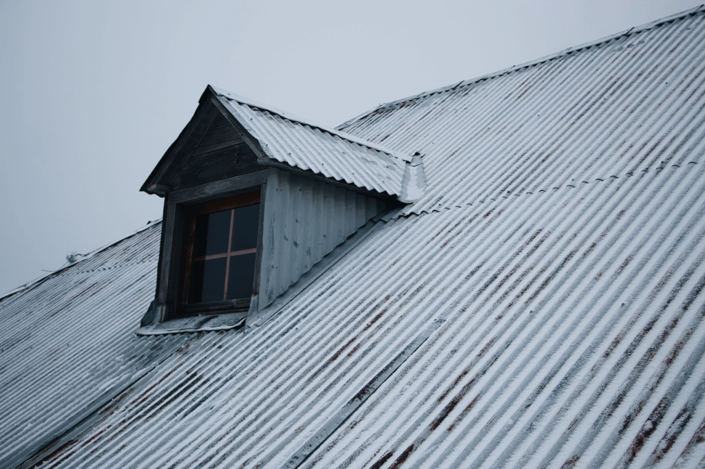 old roof of a house covered in snow