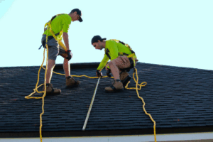 two roofing contractors conducting a roof inspection