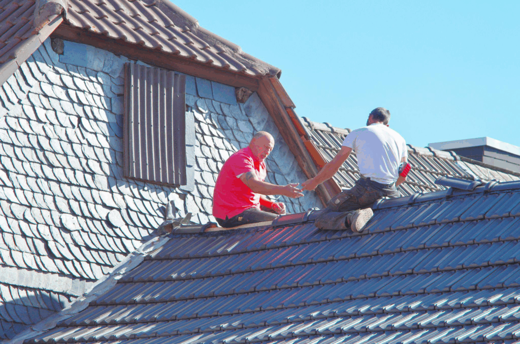 roofing contractors inspecting a roof’s structural integrity