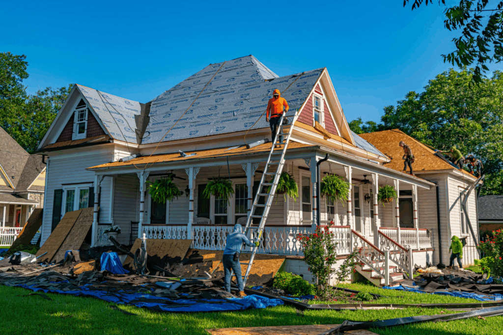 a team of roofing contractors working on a roof