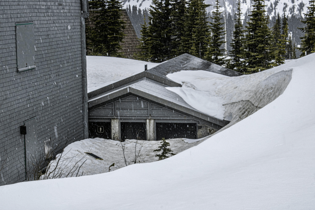 a roof covered in snow during a storm