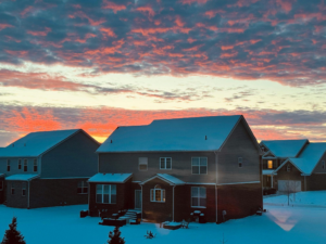 view of houses with snow-covered roofs
