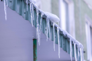 ice frozen over the corners of a roof