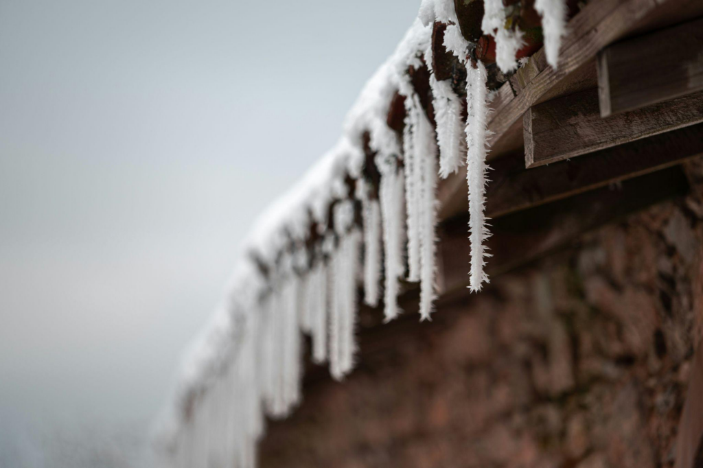 ice dams forming at the corners of a roof