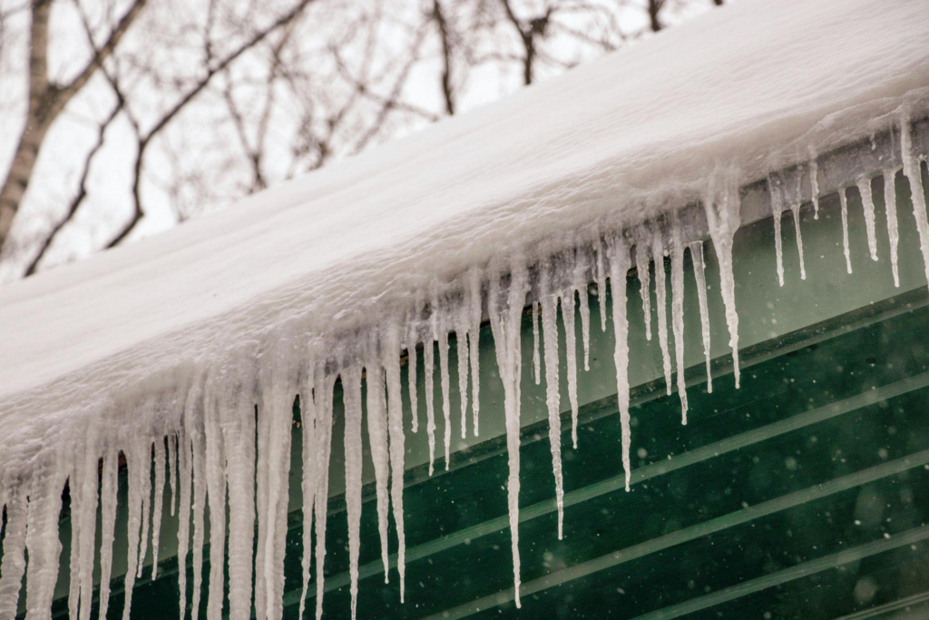 sharp icicles formed on a roof’s edge